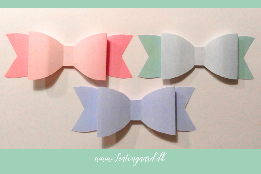 Gratis fold-selv sløjfe, hjemmelavet gavepynt, sløjfe til julegaver, sløjfe til fødselsdagsgaver, foldbar sløjfe til gaver, DIY sløjfe, gaveindpakning med sløjfe, kreativ gavepynt, nem sløjfe til mandelgave, print-selv sløjfe, pynt til julegaver og fødselsdage.